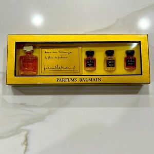 Vintage Parfums Balmain Sampler Kit in gold engraved box with protective sleeve.